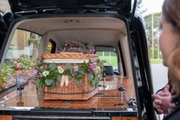 the-back-of-a-van-with-flowers-in-the-trunk.jpg the back of a van with flowers in the trunk
