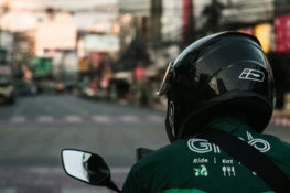 man-in-green-and-black-jacket-wearing-black-helmet.jpg man in green and black jacket wearing black helmet